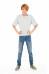 Teenage Boy standing with akimbo Stock Photo