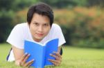 Young Man Open A Book Stock Photo