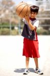 Adorable Boy With Basketball Stock Photo