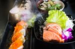 Set Of Salmon Menu Served On Black Plate Stock Photo