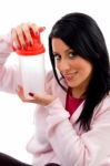 Front View Of Smiling Female Holding Water Bottle On White Background Stock Photo