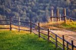 September Rural Scene In Mountains. Authentic Village And Fence Stock Photo