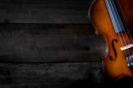 The Violin On The Table, Close Up Of Violin On The Wooden Floor Stock Photo