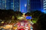 Traffic And Cityscape At Night In Guangzhou, China Stock Photo