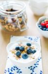 Healthy Breakfast With Granola, Yogurt And Fresh Fruits Stock Photo