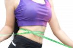 Woman In Sport Bra Measuring Her Body With Tape Isolated On Whit Stock Photo