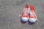 Feet Concept With Red Sneakers On Black Background With Space For Text Or Symbol. Vintage Tone Stock Photo