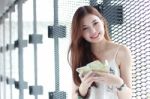 Portrait Of Thai Adult Beautiful Girl Using Her Smart Phone And Smile Stock Photo