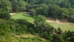 Green Field Golf Club In Tropical Forest Stock Photo