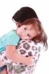 Child Hugging Her Mom Stock Photo