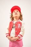 Little Girl Fashion Model With Red Cap Stock Photo