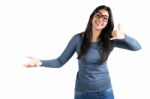 Happy Young Latin Woman Making A Call Me Gesture Stock Photo