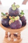 Group Of Mangoesteen On Wooden Tray Stock Photo