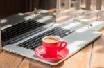 Hot Coffee Cup On Wooden Work Station Stock Photo