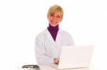 Woman Doctor With Laptop Stock Photo