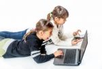 Little Girls Playing Games On The Notebook And Tablet Isolated On White Stock Photo