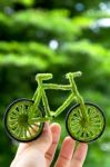 Hand Holding Eco Bicycle Stock Photo