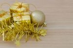 Gold Christmas Bauble And Three Present Boxes Stock Photo