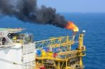 The Gas Flare Is On The Offshore Oil Rig Stock Photo