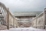 Ice Covered Staircase On The Beach Stock Photo