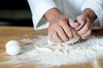 Man Kneading Dough, Closeup Shot Stock Photo