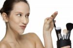 Woman Applying Make Up With Brush Stock Photo