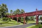 Red Wood Bridge In The Park Stock Photo