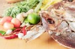 Dried Fish And Curry On Wooden Stock Photo