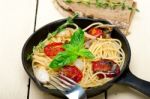 Spaghetti Pasta With Baked Cherry Tomatoes And Basil Stock Photo