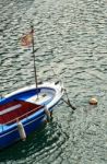 Blue Boat With Flag Stock Photo