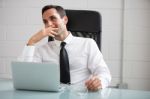 Businessman With Earphones Stock Photo