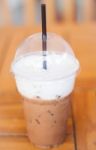 Iced Mocha Coffee In Glass On The Table Stock Photo