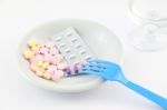 Medicine Tablet Dish With Fork On Table Stock Photo