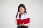 Asia Thai High School Student Uniform Beautiful Girl Read A Book Stock Photo