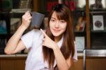 Portrait Of Thai Adult Student University Uniform Beautiful Drinking Coffee Stock Photo