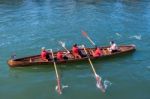 Unidentified Man And Boys Exhausted At The End Of A Rowing Boat Stock Photo