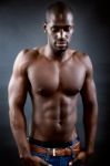 Beautiful And Muscular Man In Dark Background Stock Photo