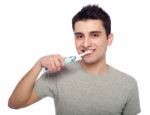 Young Man Brushing Teeth Stock Photo