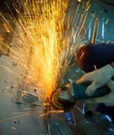 Hand Of Worker Working With Electric Wheel Stock Photo