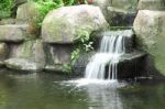 Small Waterfall In Public Tropical Garden Stock Photo