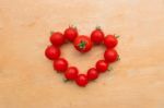 Cherry Tomato Fresh In Heart Shape On Wooden Chopping Board, Flat Lay Stock Photo