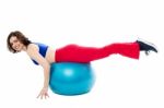 Attractive Woman Exercising With Swiss Ball Stock Photo