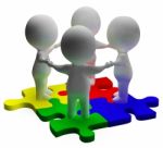 Puzzle Solved And 3d Characters Shows Unity And Teamwork Stock Photo