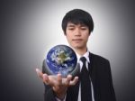 Businessman Holding World Stock Photo