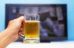 Beer In Front Of The Television Stock Photo