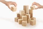 Two Hands Playing Wooden Box On Isolated Background Stock Photo