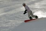 Female Snowboarder In Powder Snow Stock Photo