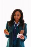 Teenage School Girl In Uniform Chooses Between Healthy Apple Fruit Or Unhealthy Chocolate Snack Stock Photo