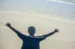 Shadow Man On Beach Stock Photo