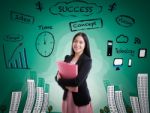 Asian Woman Smiling On Business Background Stock Photo